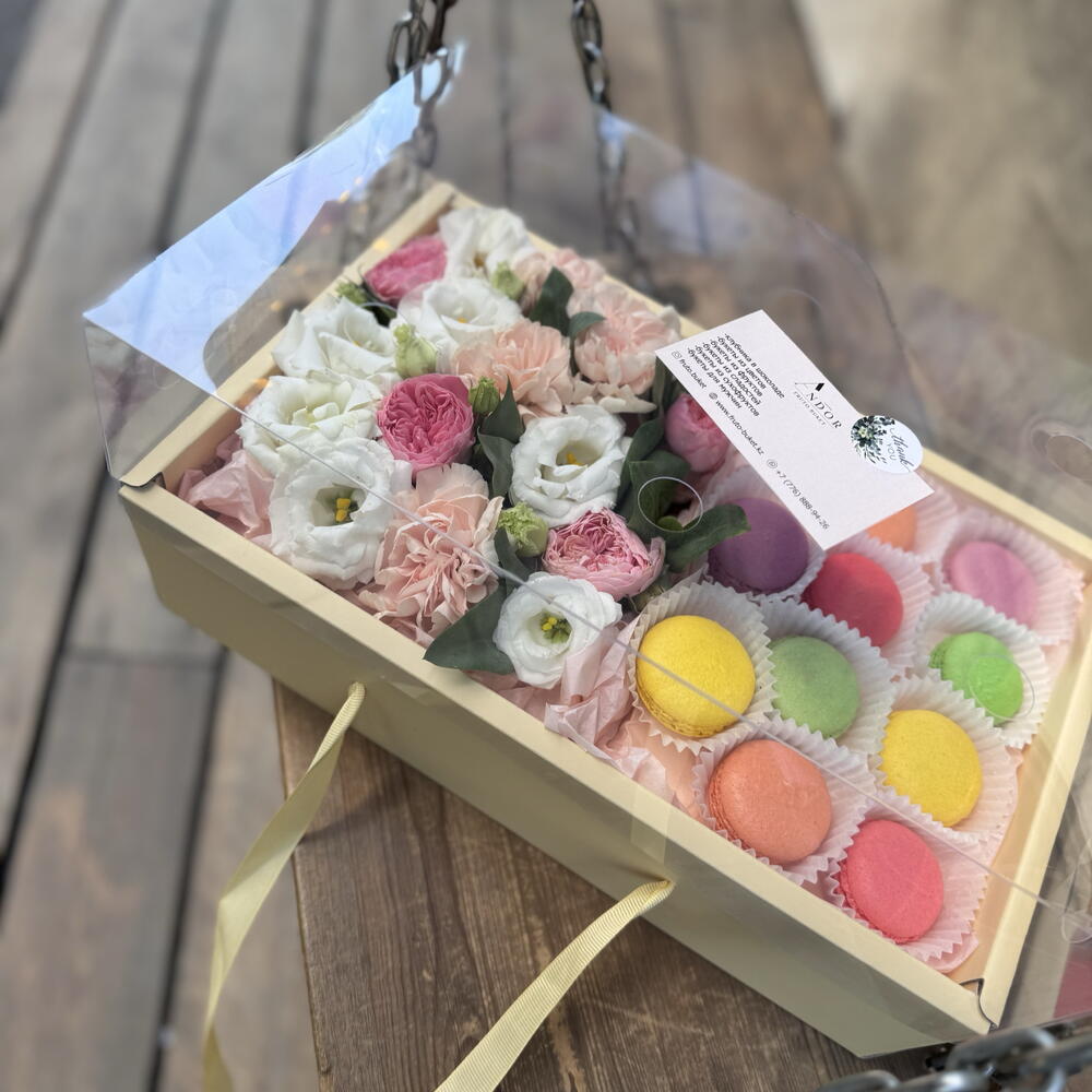 Flowers with macarons in a large box
