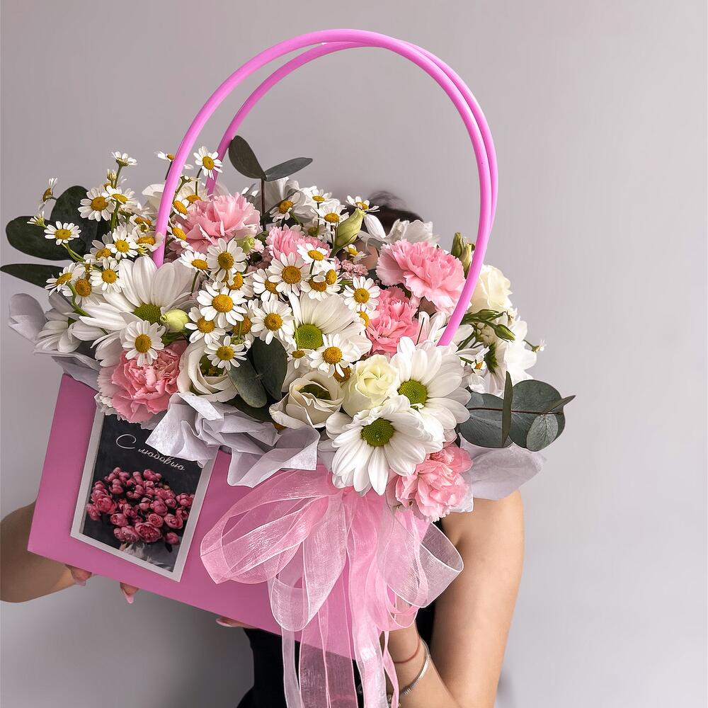 Basket with flowers and a card