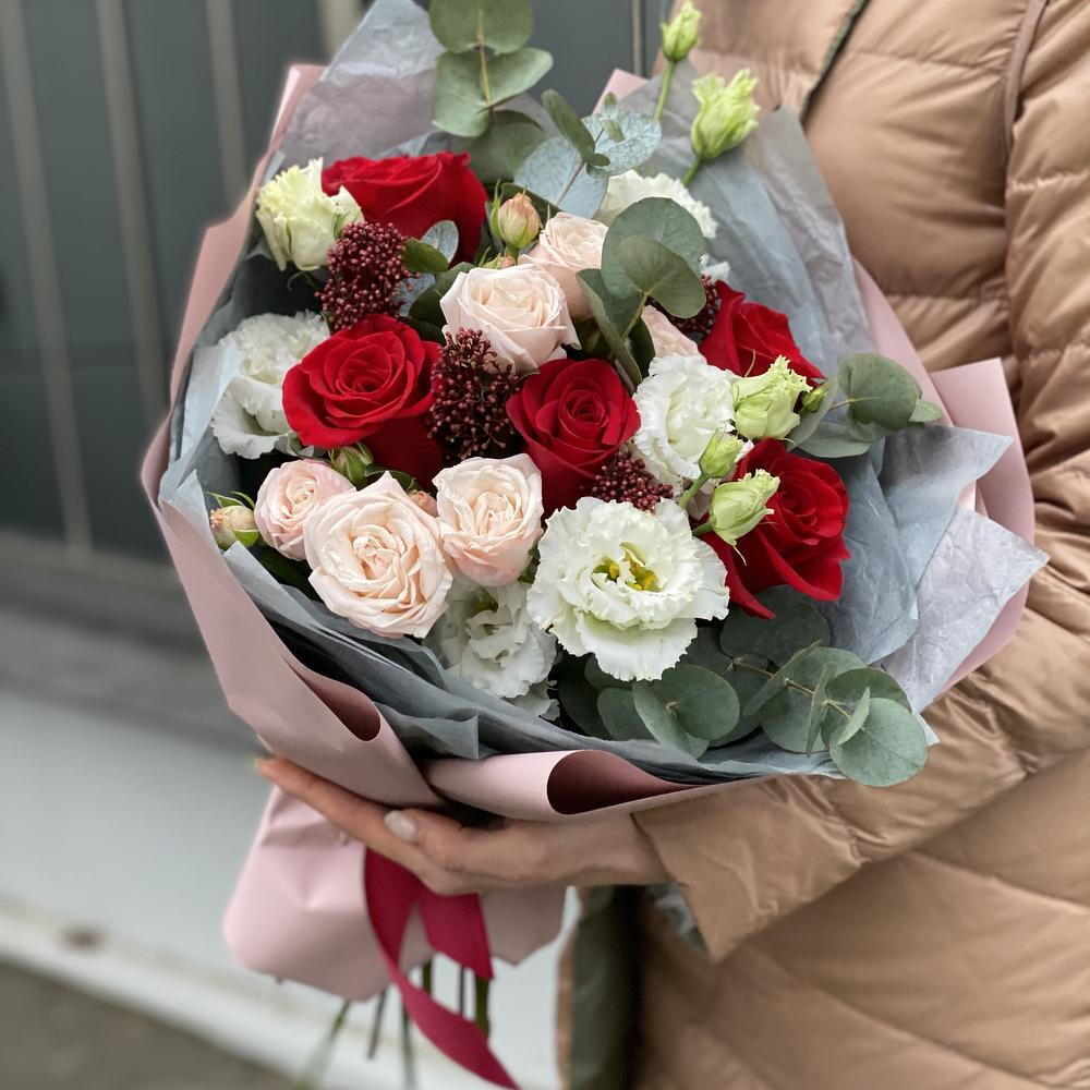Bouquet of single-headed and bush roses, eustoma, skimmia and eucalyptus Flower ball