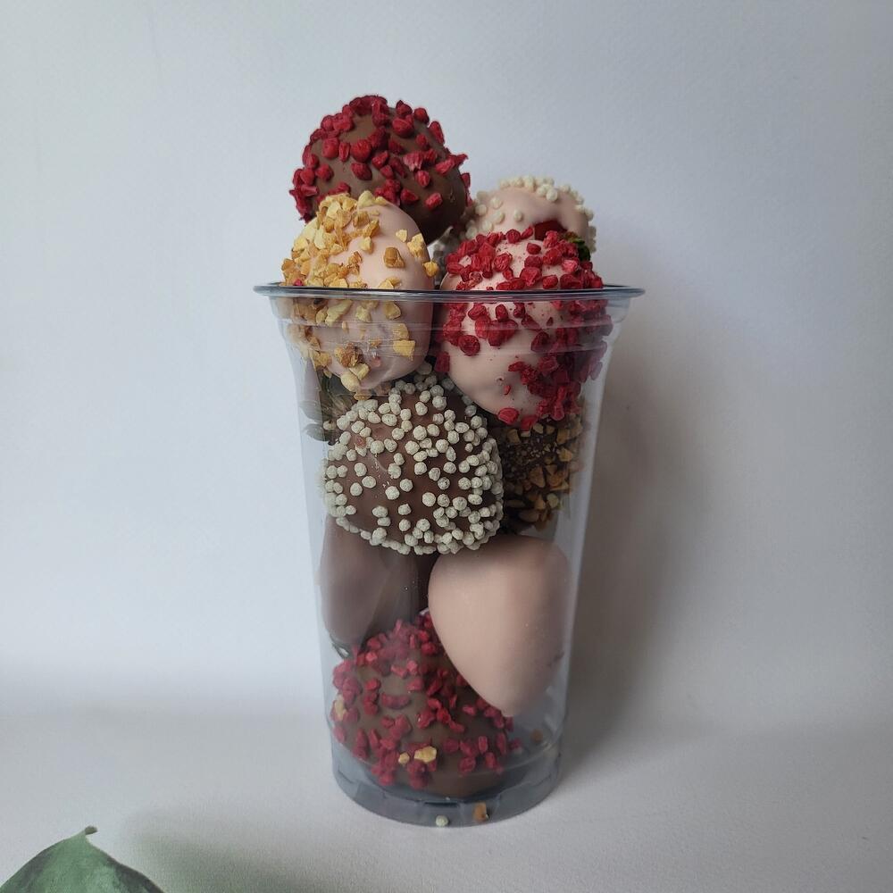A glass of strawberries in milk and white chocolate