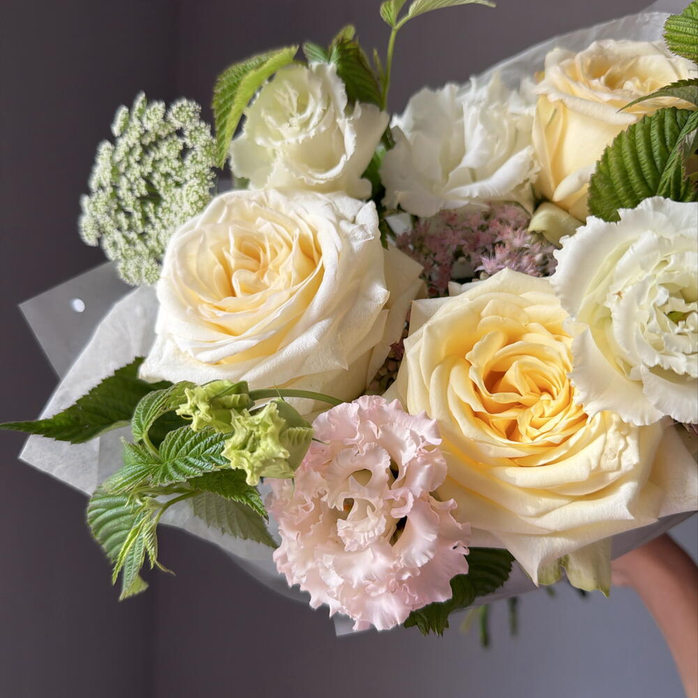 Delicate bouquet with peony-shaped roses and sedum
