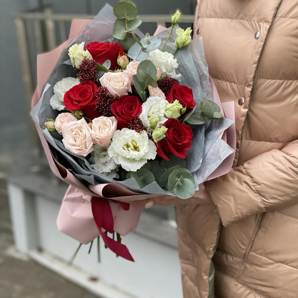 Bouquet of single-headed and bush roses, eustoma, skimmia and eucalyptus Flower ball