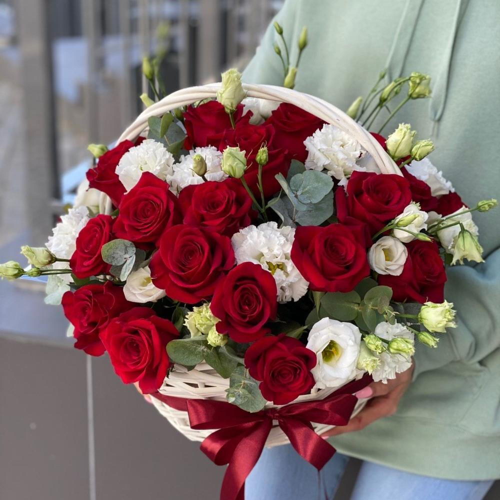 Basket of red roses and eustoma Scarlet flower