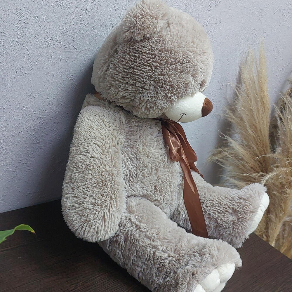 Игрушка медведь с коричневым бантом