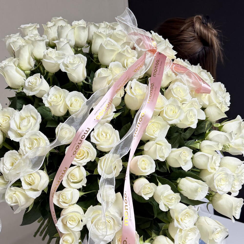 101 white roses with a ribbon