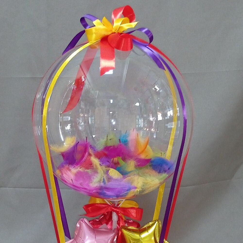 A basket with a bubble ball and candies