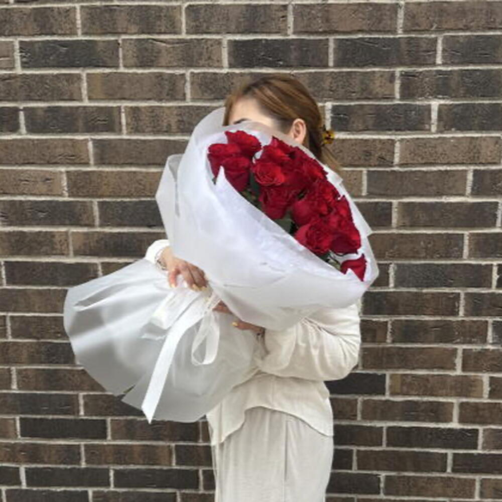 21 burgundy roses in packaging