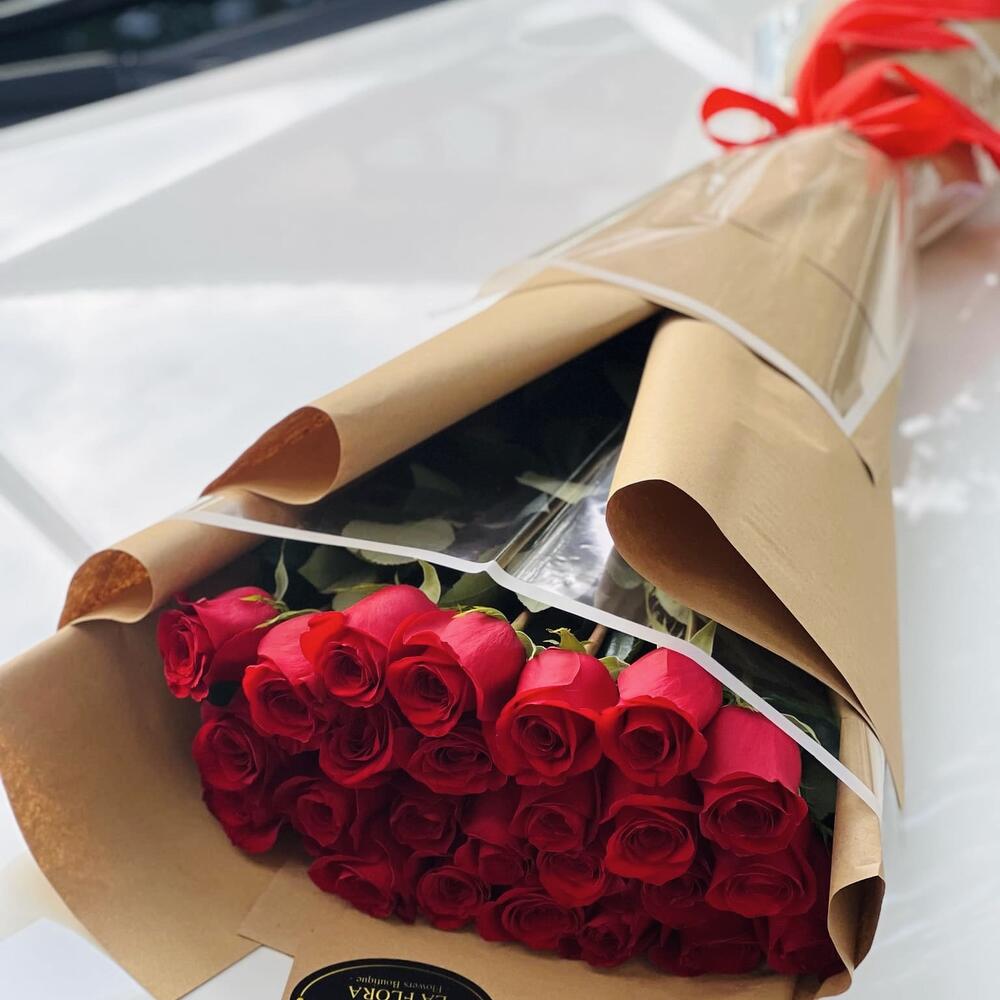 25 red roses in craft wrapp