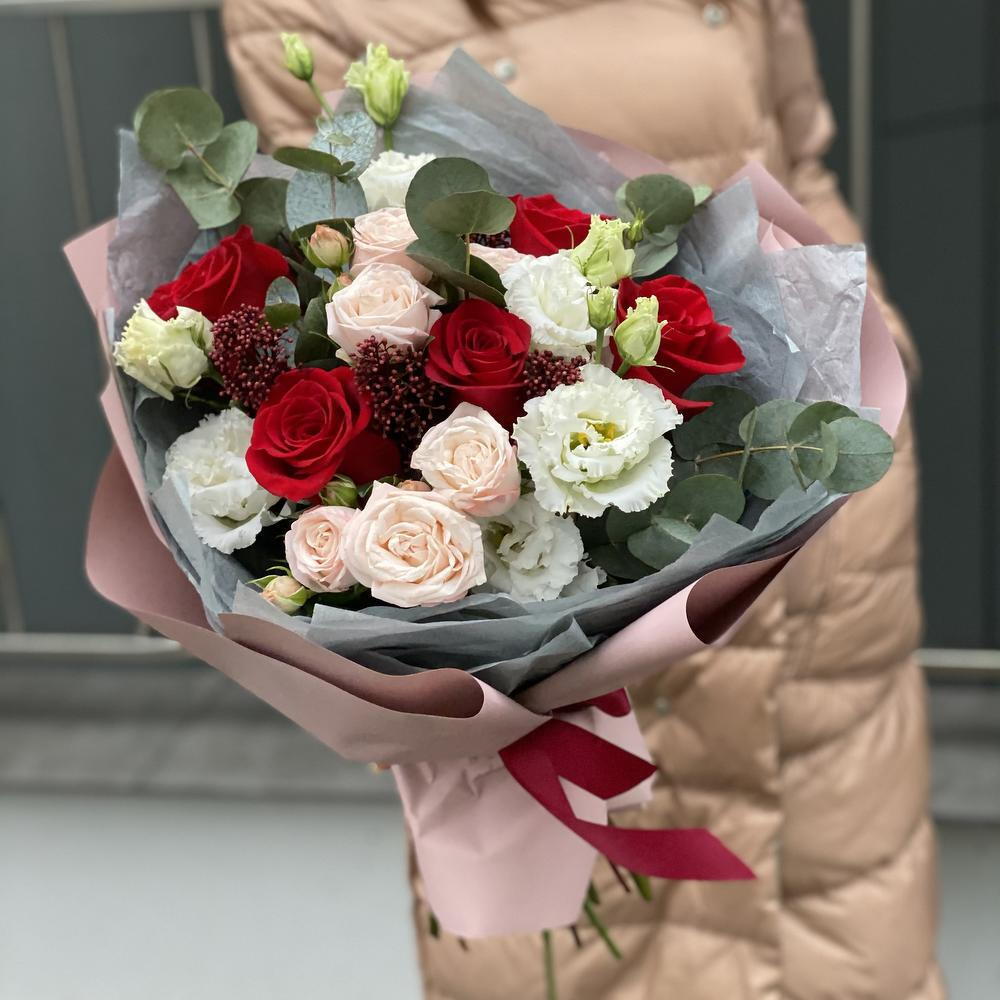 Bouquet of single-headed and bush roses, eustoma, skimmia and eucalyptus Flower ball