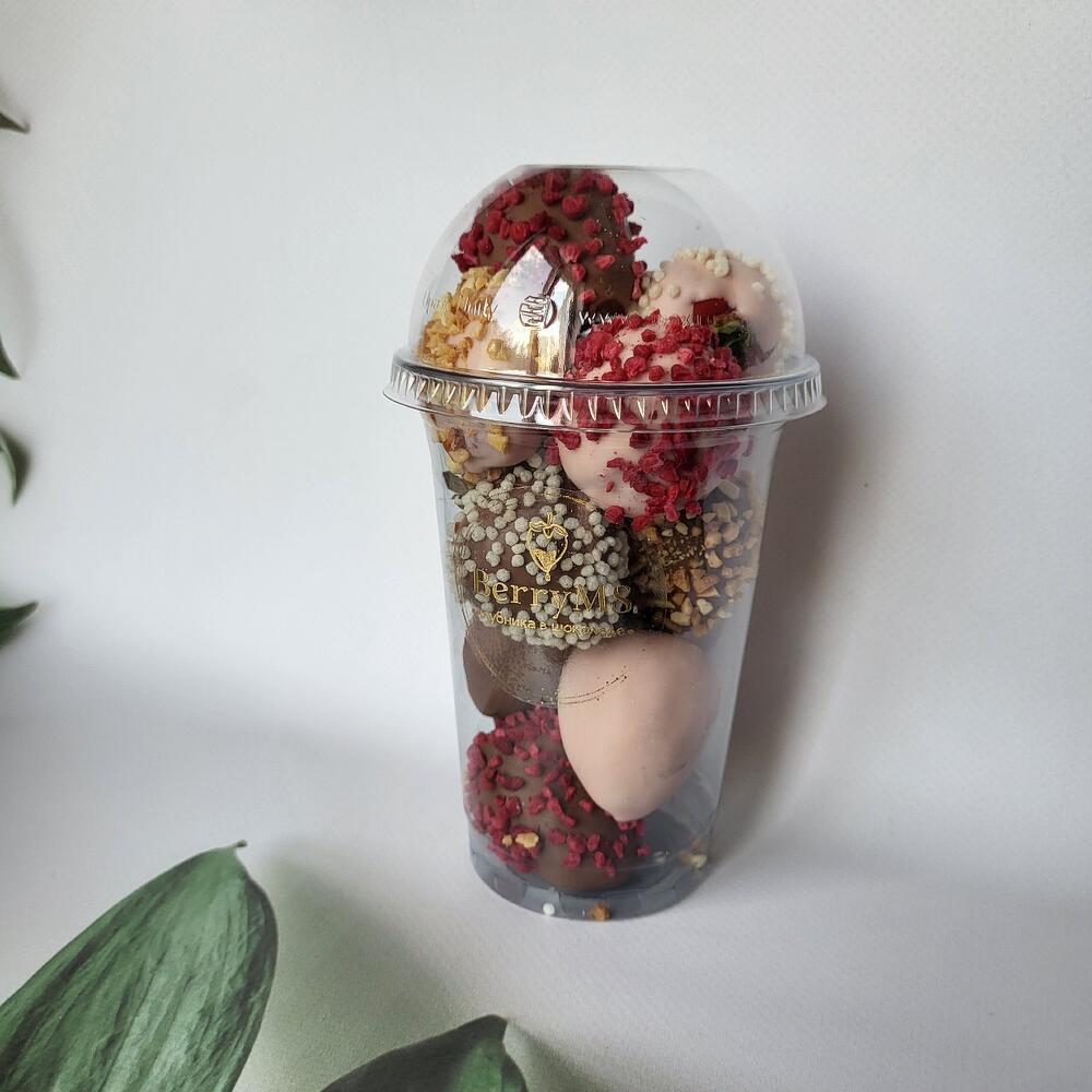 A glass of strawberries in milk and white chocolate