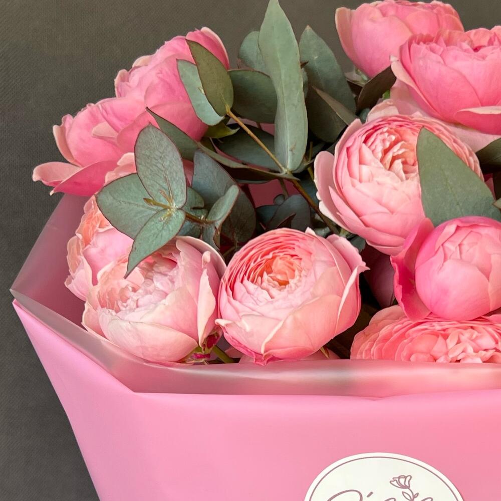 Peony-shaped crimson roses and eucalyptus