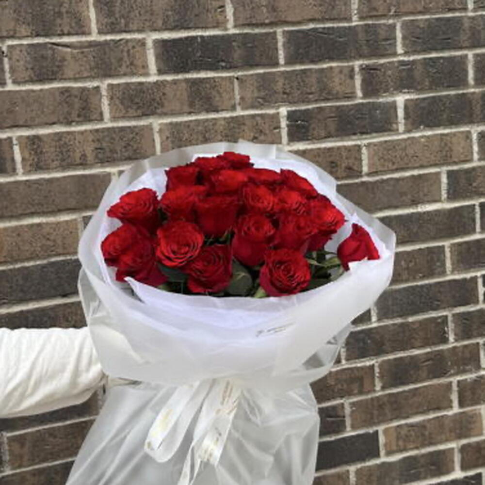 21 burgundy roses in packaging