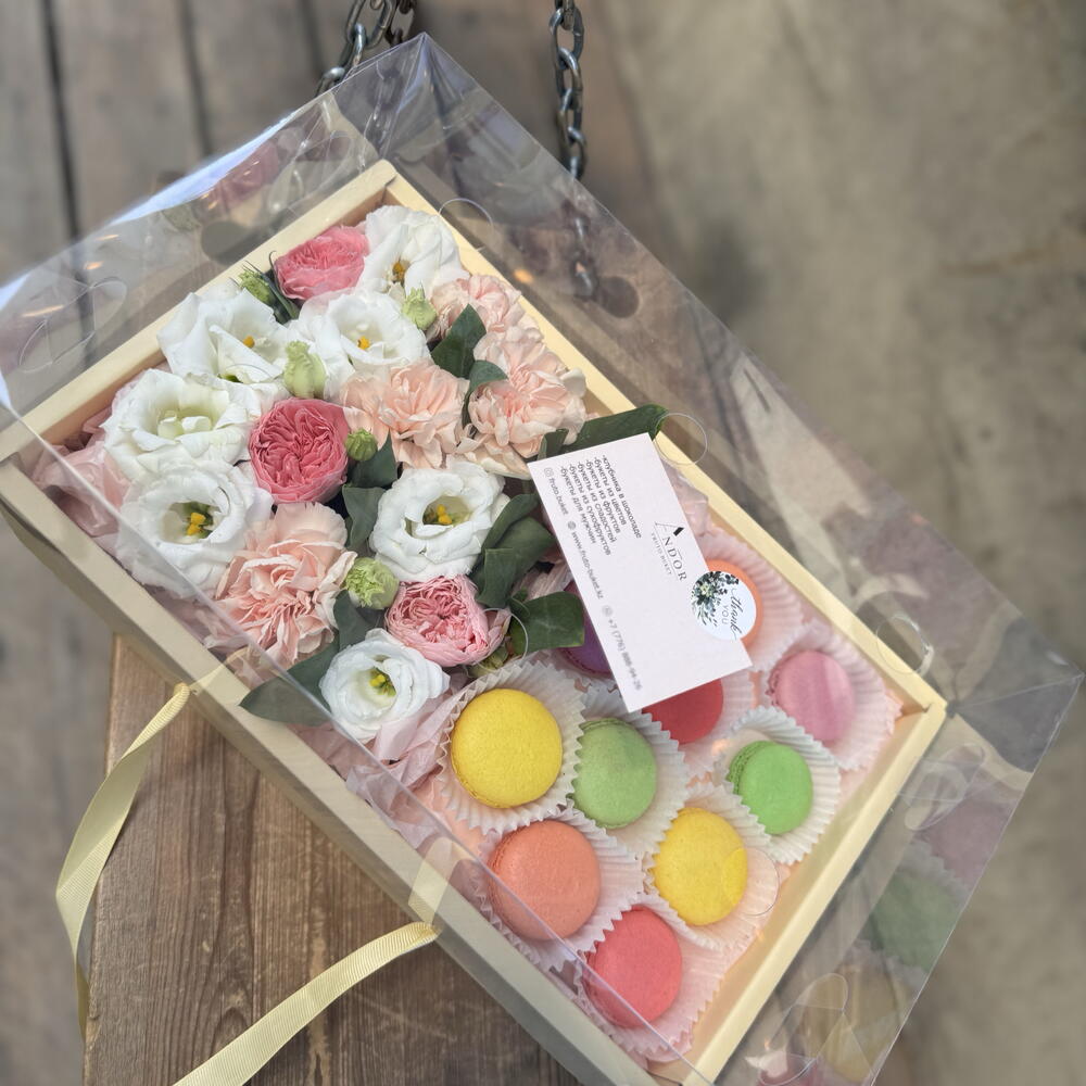 Flowers with macarons in a large box
