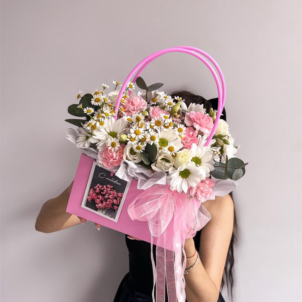 Basket with flowers and a card