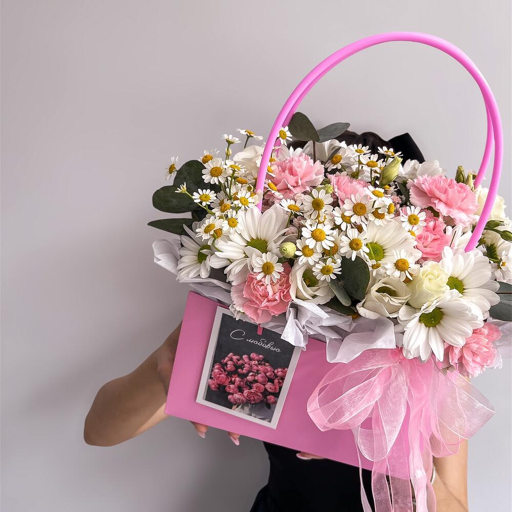 Basket with flowers and a card