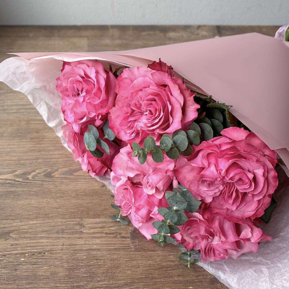 Bright bouquet with a Country Blues rose and eucalyptus sprigs