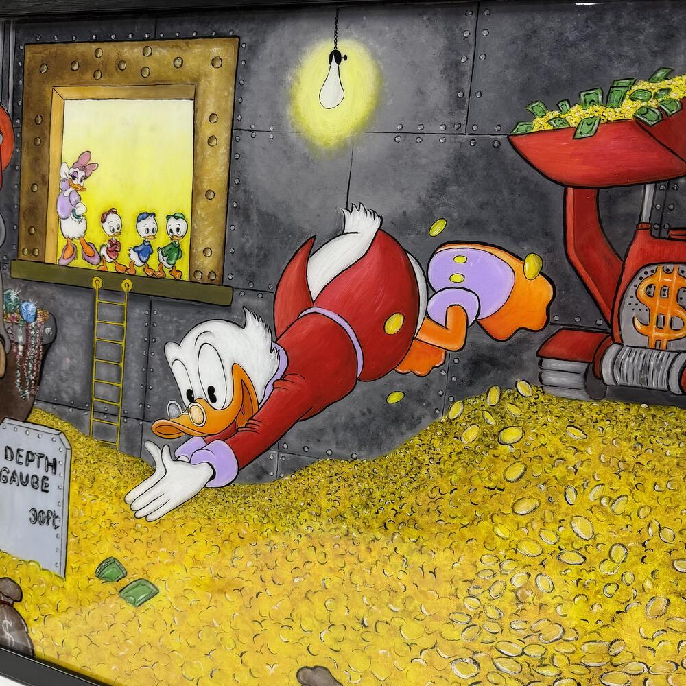 The Scrooge painting in gold is coated with epoxy resin