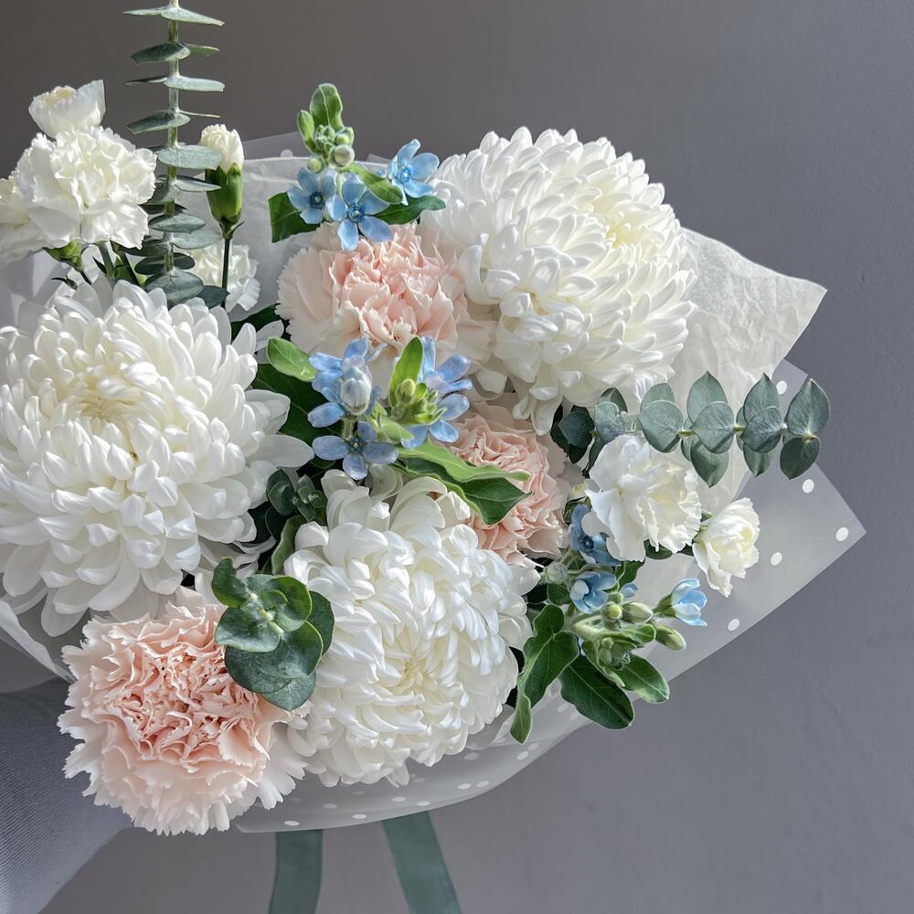 Delicate bouquet with hair curlers and dianthus