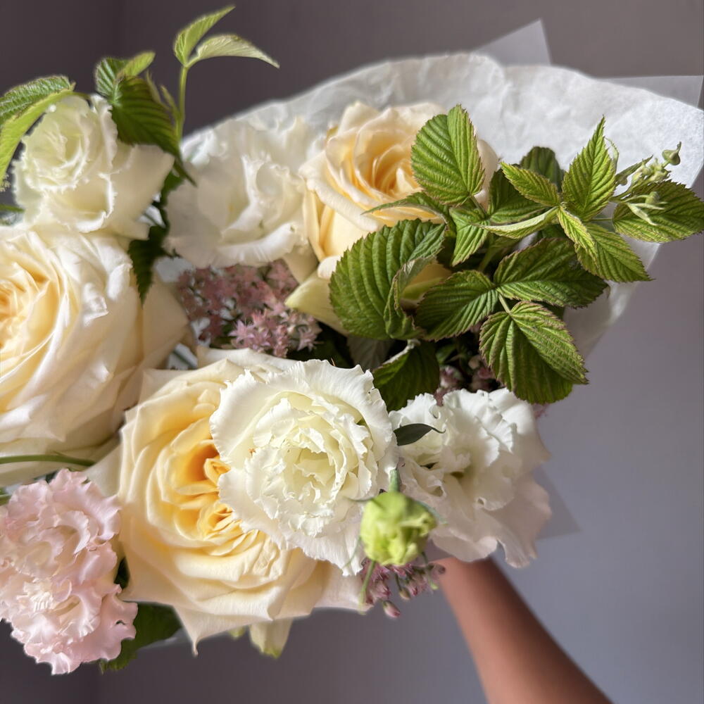 Delicate bouquet with peony-shaped roses and sedum