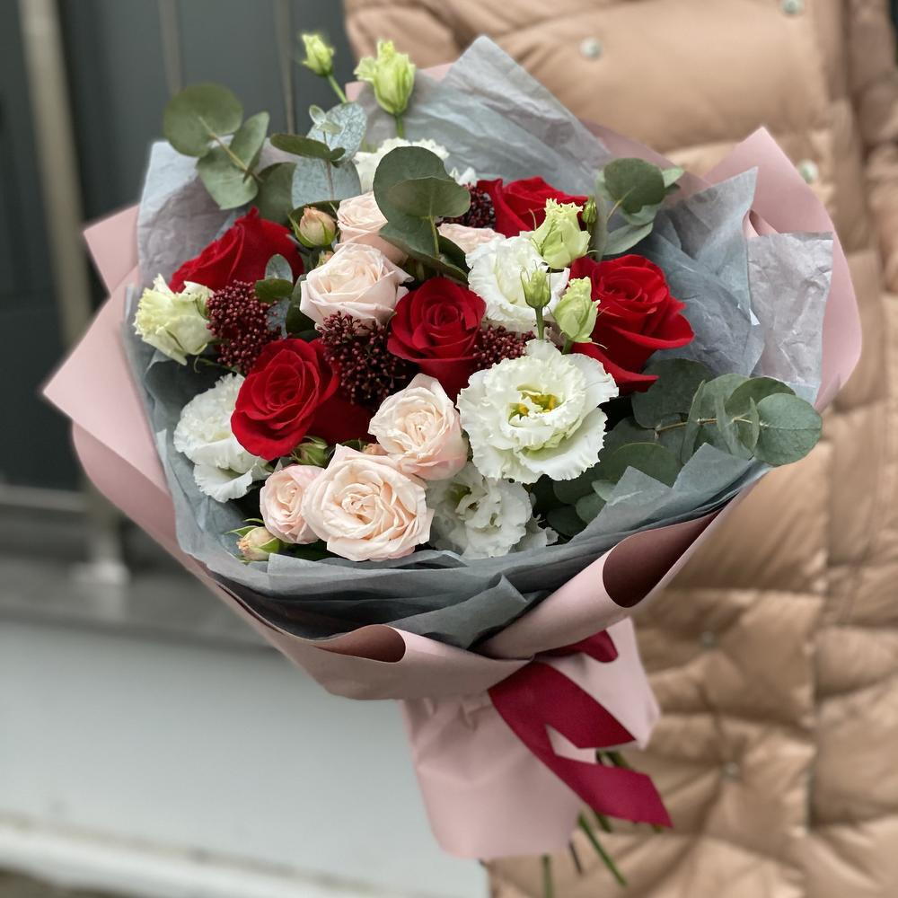 Bouquet of single-headed and bush roses, eustoma, skimmia and eucalyptus Flower ball
