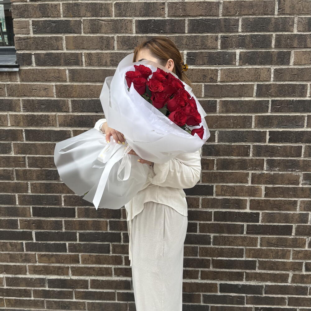 21 burgundy roses in packaging