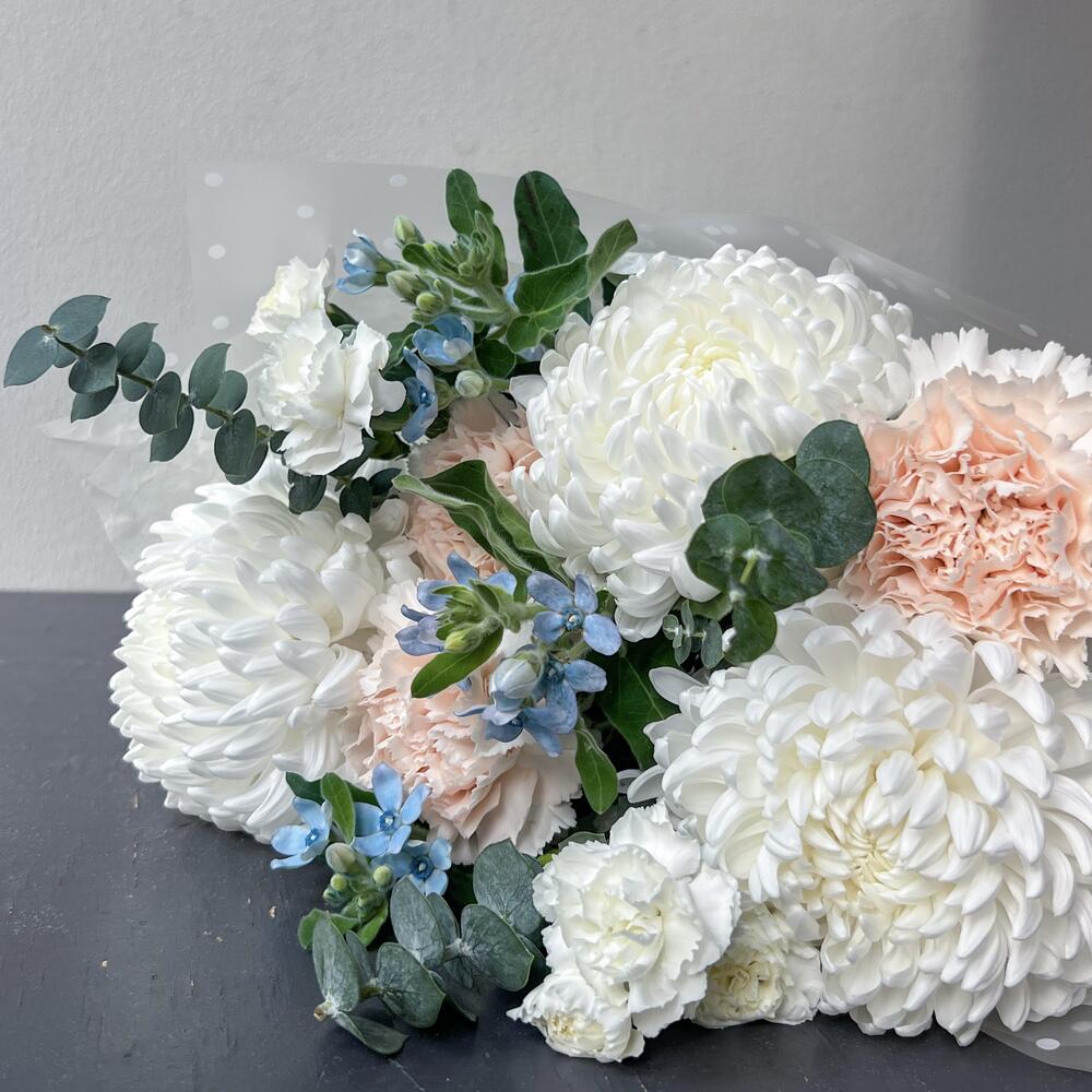 Delicate bouquet with hair curlers and dianthus