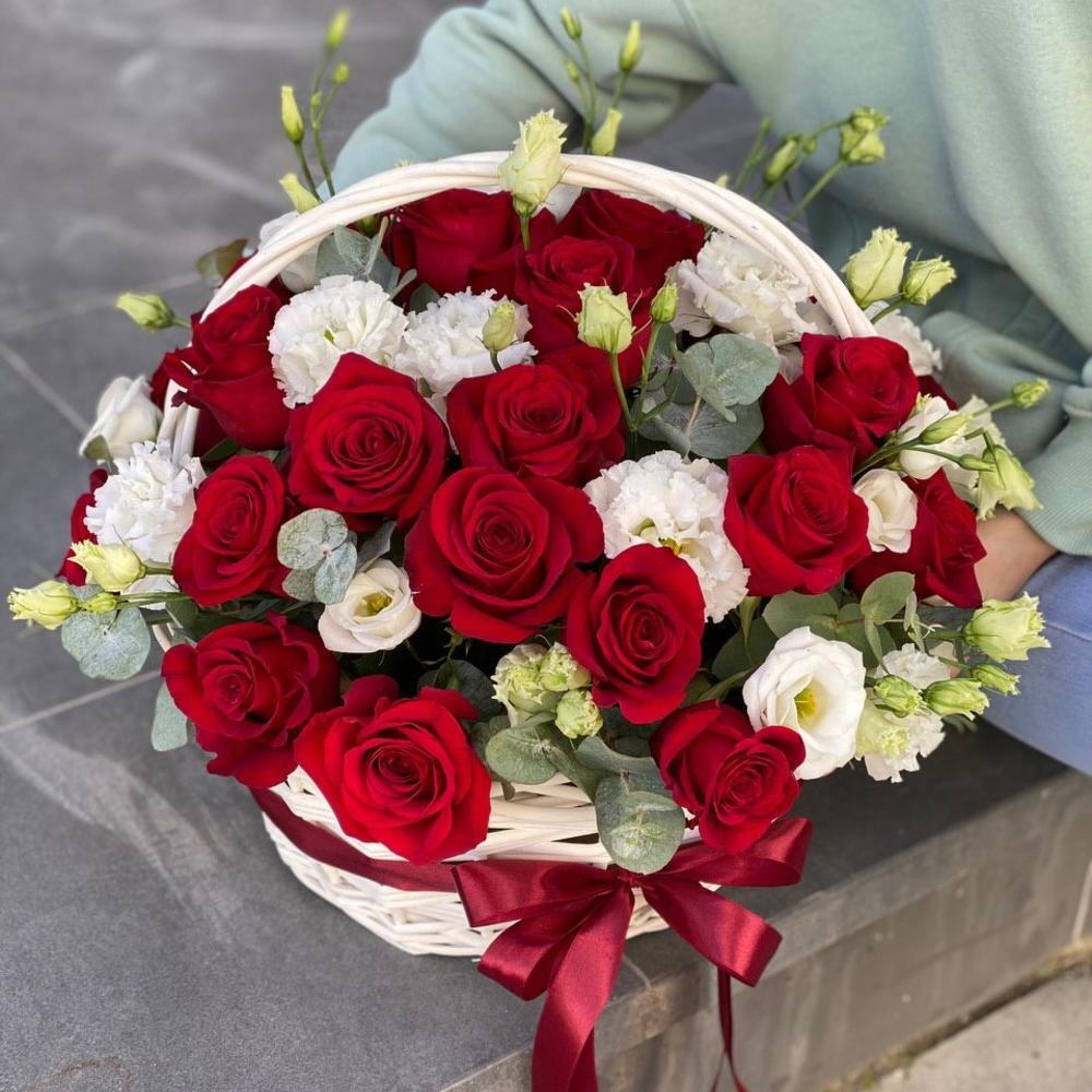 Basket of red roses and eustoma Scarlet flower