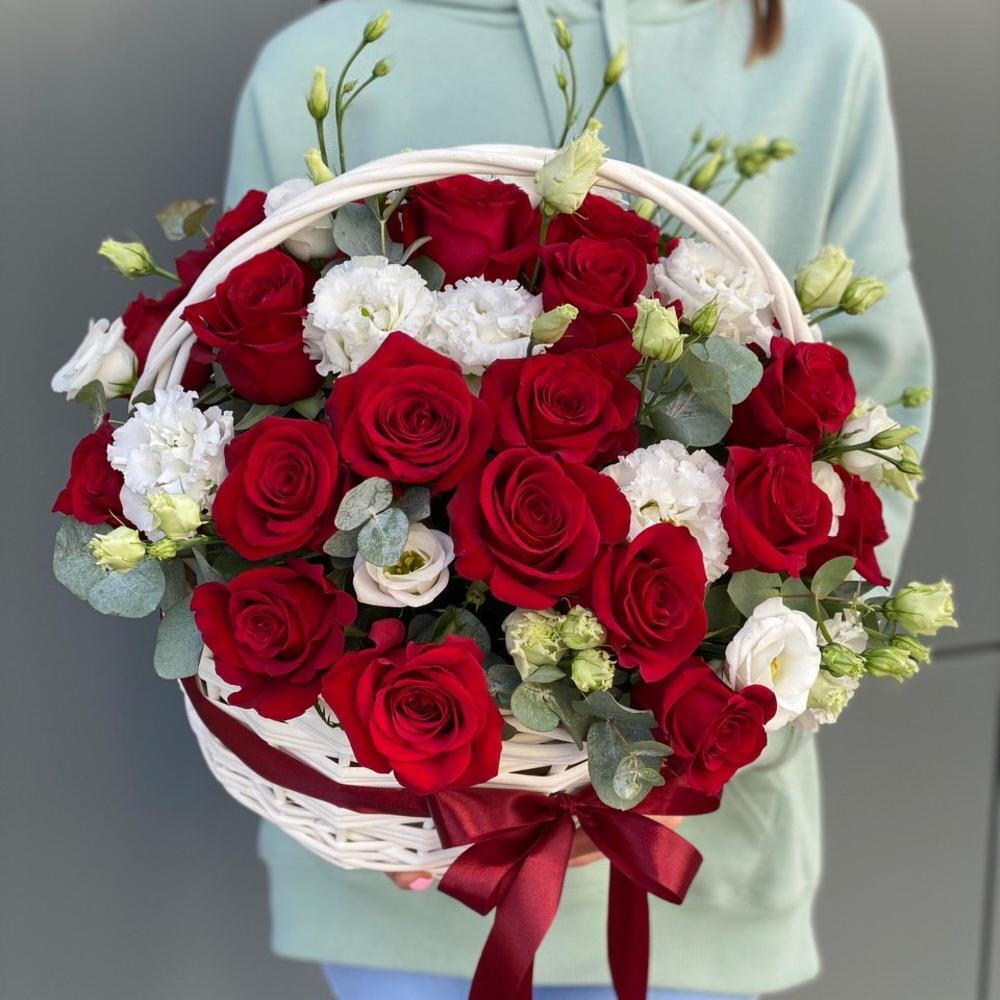 Basket of red roses and eustoma Scarlet flower