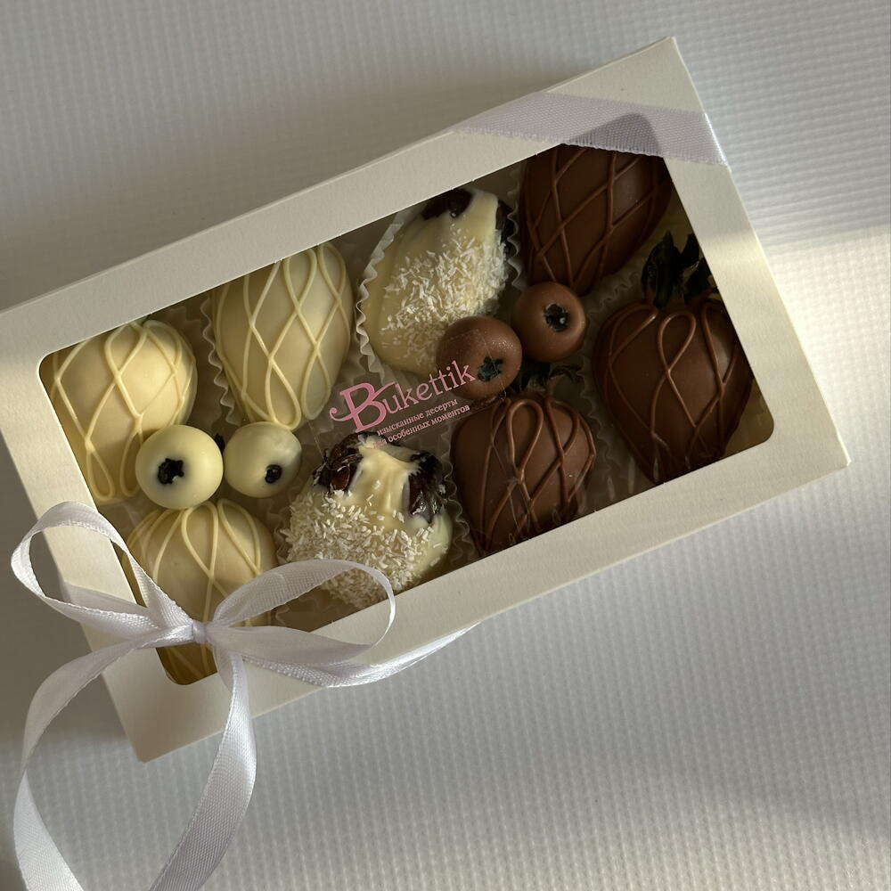 Set of strawberries, dates with fillings and blueberries in chocolate "Yin-Yang"