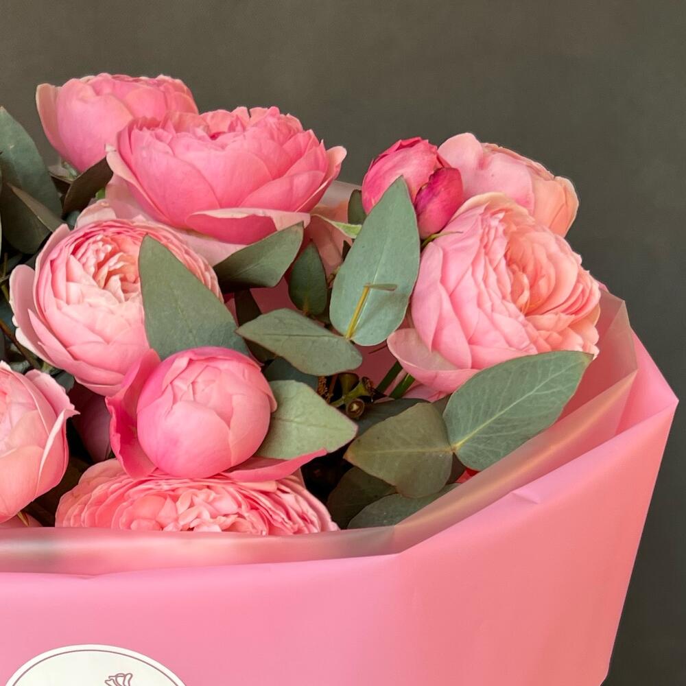Peony-shaped crimson roses and eucalyptus