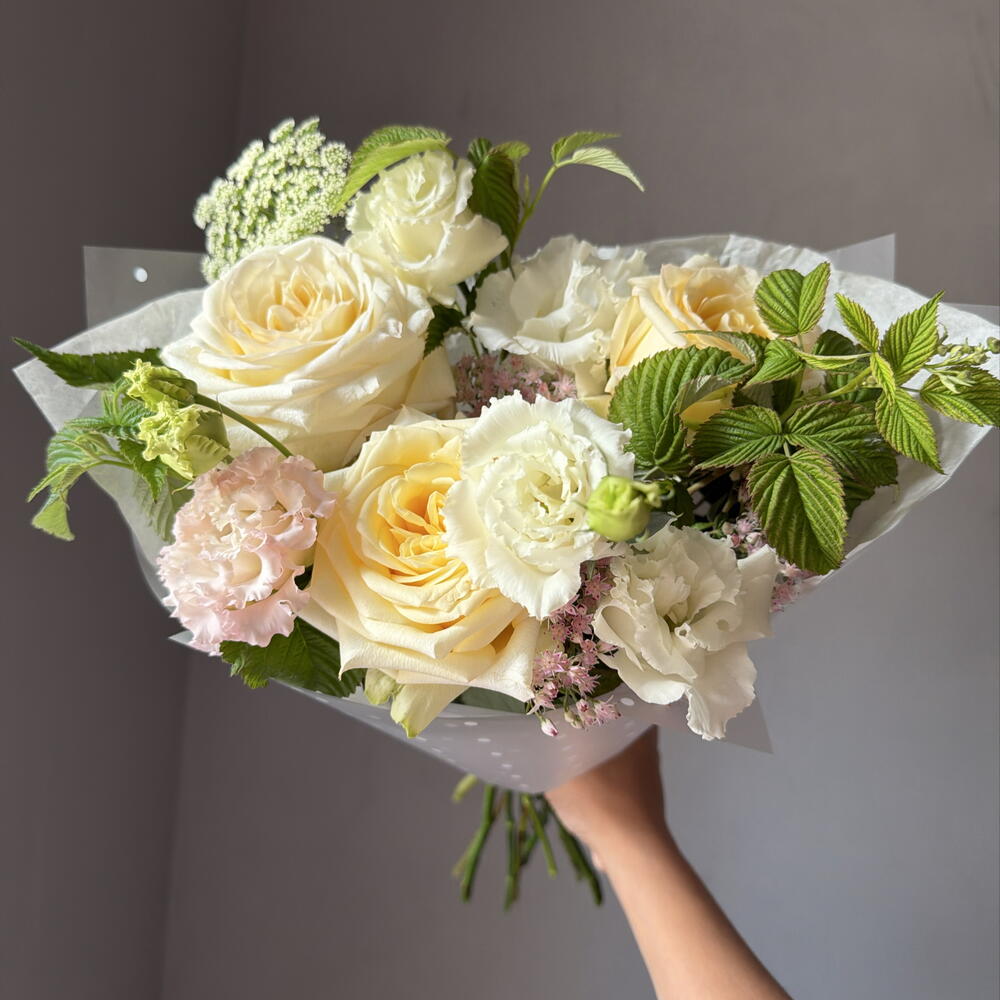 Delicate bouquet with peony-shaped roses and sedum