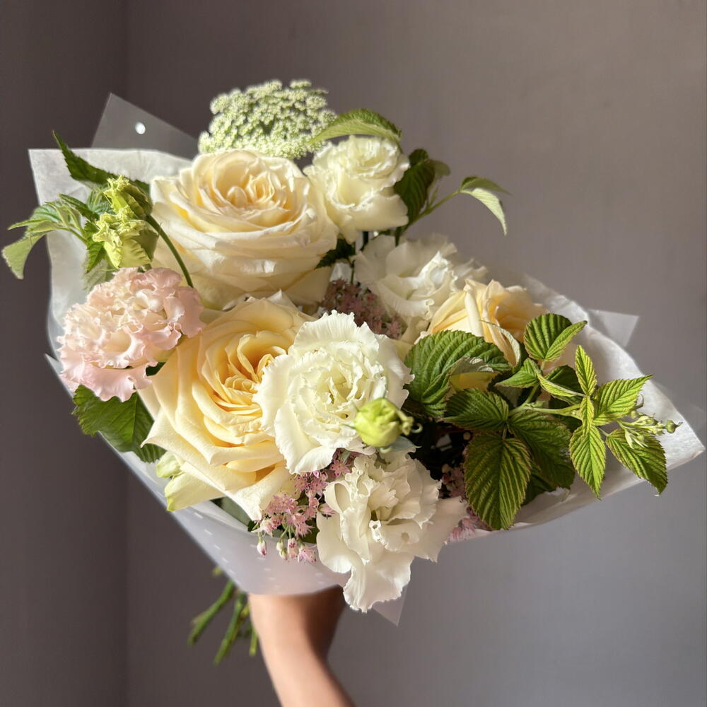 Delicate bouquet with peony-shaped roses and sedum