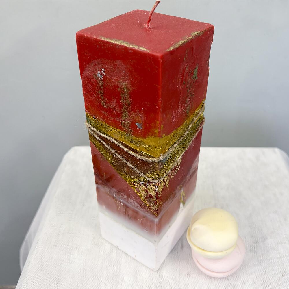 Designer red candle with gold