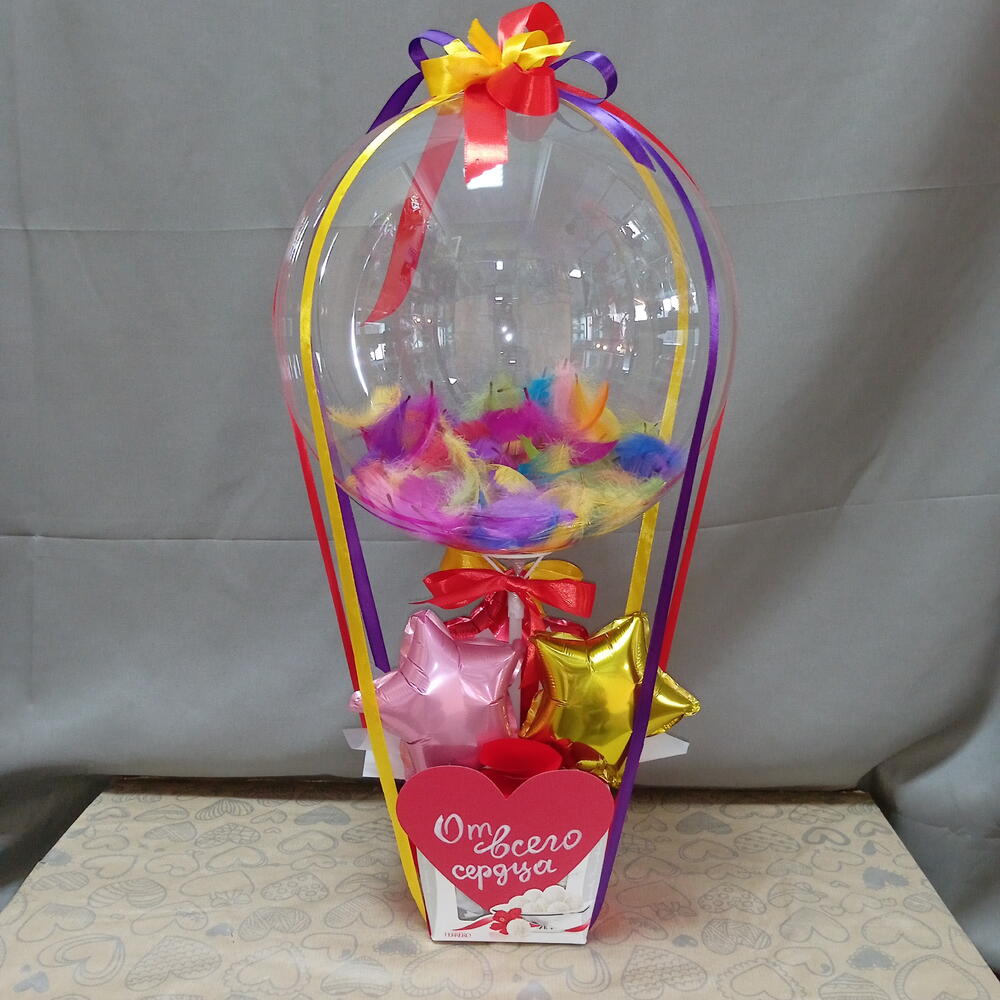 A basket with a bubble ball and candies