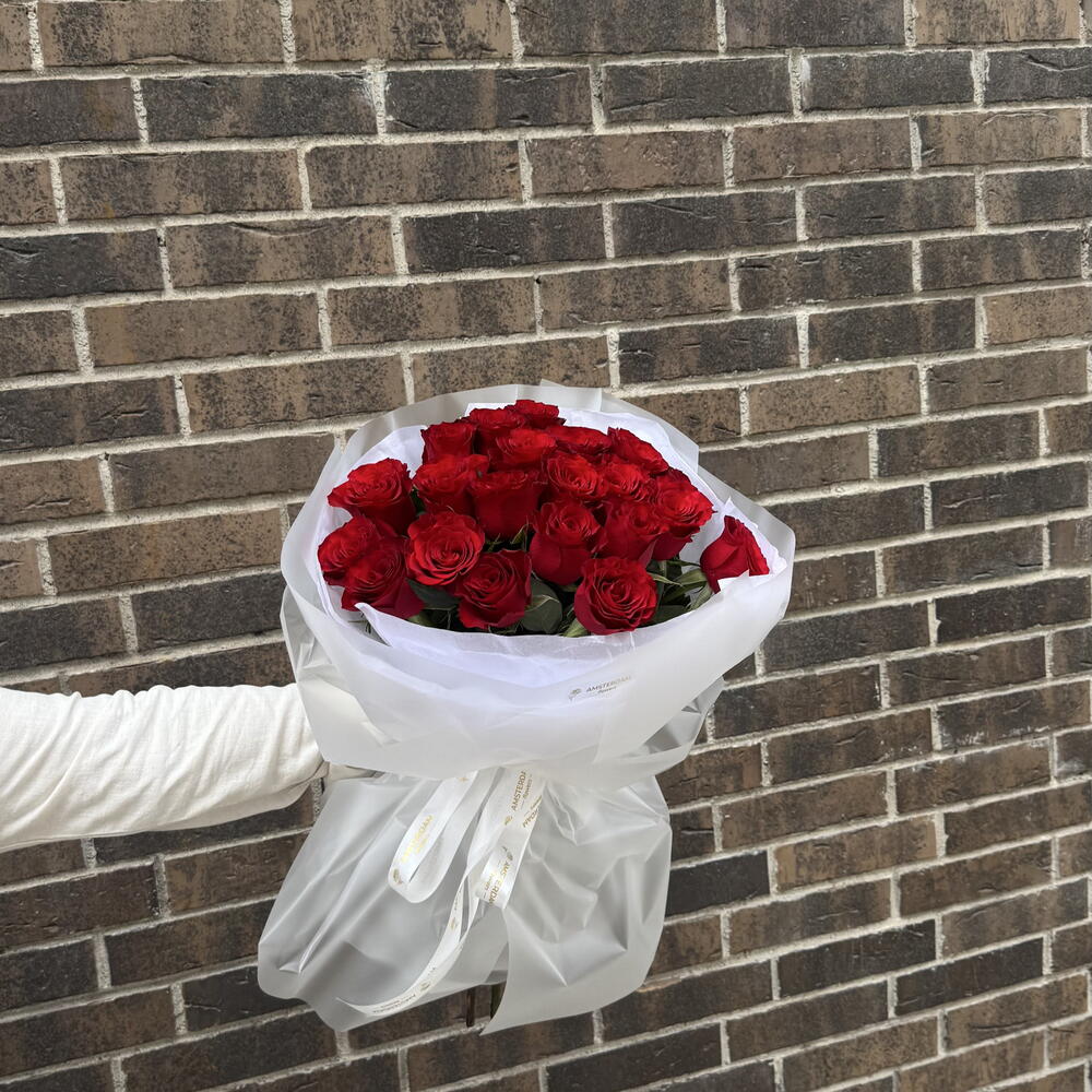 21 burgundy roses in packaging