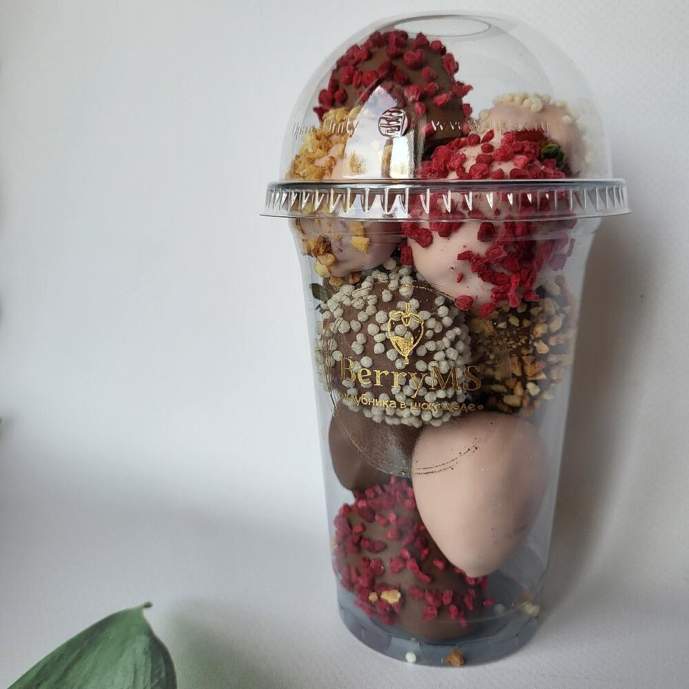 A glass of strawberries in milk and white chocolate