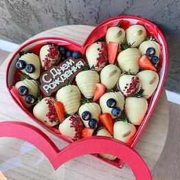 Chocolate-covered strawberries blueberries sprinkled with heart