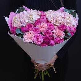 Bouquet with pink Hydrangeas, bushy peony-shaped roses and Eucalyptus