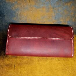 The wallet is made of genuine leather, handmade. Color: White and red