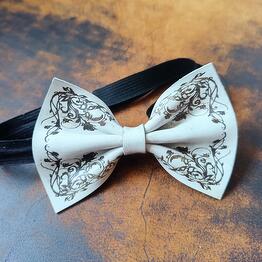 A butterfly made of genuine leather. Handmade work. Color: white. Pattern: Floral symmetrical
