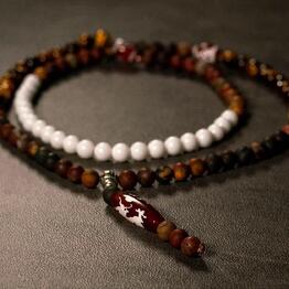 Beads made of natural stones with a Ji dragon and Guru bead