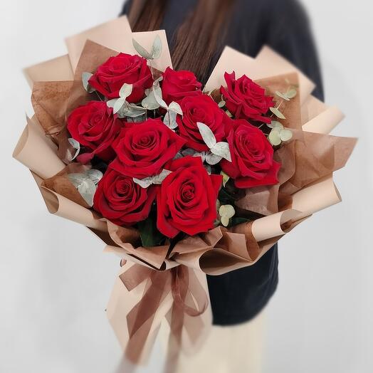 Bouquet of red roses and eucalyptus