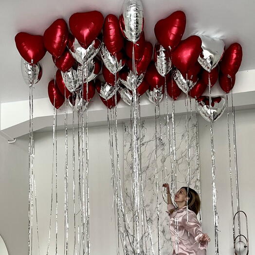 Balls of hearts in the ceiling with rain