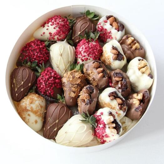 Strawberries and dates with nuts in chocolate set