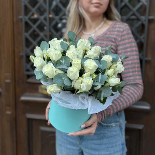 White spray roses with eucalyptus in a box