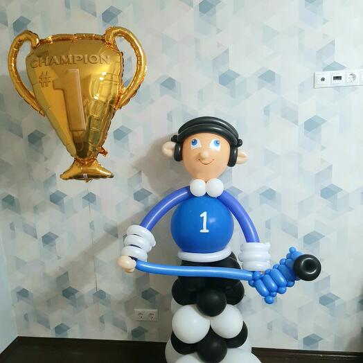 Jugador de hockey de globos con Copa