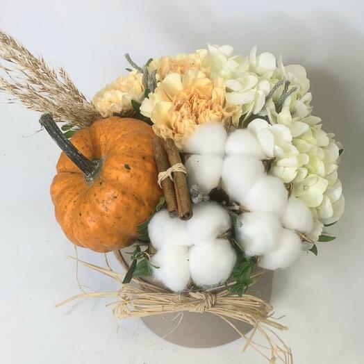 Flowers in a box. Pumpkin salad with orange pumpkin, cotton, and peach dianthus