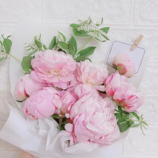 Bouquet of pink peonies and greenery