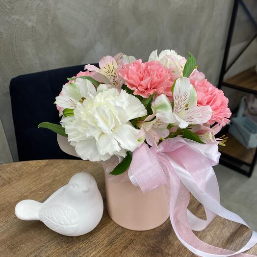 Floral arrangement of dianthus and alstroemeria in a hatbox