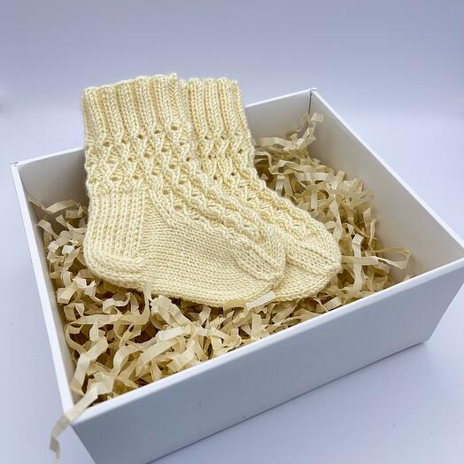 Socks knitted for a newborn from merino wool